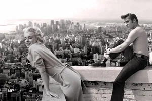Marilyn Monroe And John Lennon On The Top Of A Building Wallpaper