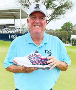 Mark Calcavecchia Holding A Shoe Wallpaper