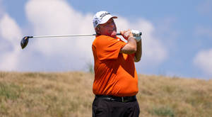 Mark Calcavecchia In Vibrant Orange Polo Shirt Wallpaper