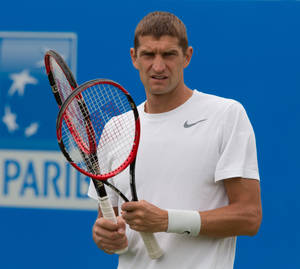 Max Mirnyi Holding Two Tennis Rackets Wallpaper