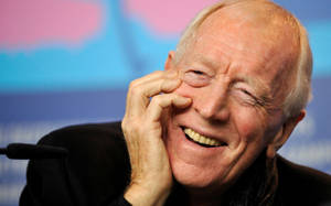 Max Von Sydow At A Press Conference Wallpaper