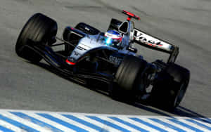 Mclaren Formula 1 Team Leading The Race Wallpaper