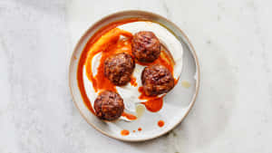 Meatballsin Creamy Tomato Sauce Wallpaper