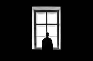 Melancholy Man Gazing Out Of The Window Wallpaper