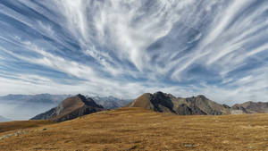 Merano 2000 Avelengo Italy Mountain Cliff With Cloudy Sky Wallpaper