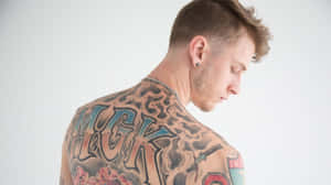 Mgk Showing His Back Wallpaper