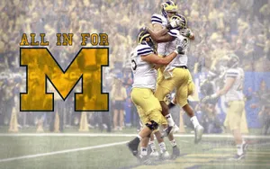 Michigan Wolverines Fans Cheering In Excitement Wallpaper