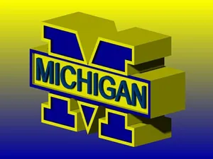 Michigan Wolverines Football Team Charging Onto The Field Wallpaper