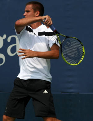 Mikhail Youzhny In Action, Showcasing Tennis Skills Wallpaper