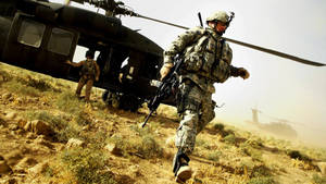 Military Helicopter Unloading Soldiers Wallpaper