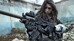 Military Woman Holding Assault Rifle Wallpaper