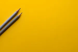 Minimal Orange Desk And Pencil Wallpaper