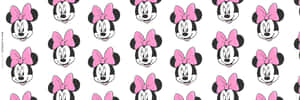 Minnie Mouse In Her Signature Pink Outfit Wallpaper