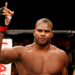 Mma Fighter Alistair Overeem Pointing Up Wallpaper