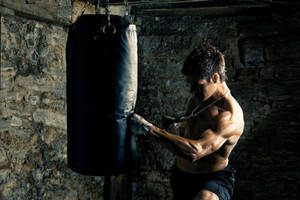 Mma Fighter Punch Practice Wallpaper