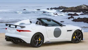 Modern Jaguar Car On Beach Wallpaper