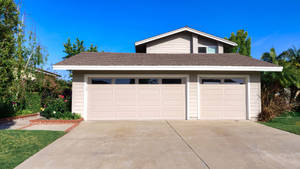 Modern Vintage Home Garage With Sprawling Driveway Wallpaper