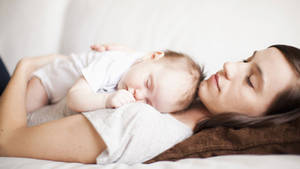 Mom And Son Napping Wallpaper