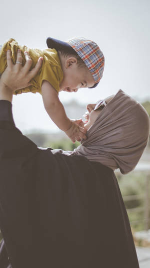 Mom And Son With Hijab Wallpaper