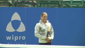 Monica Niculescu Holding Champagne Bottle Wallpaper