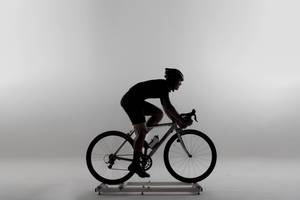 Monochrome Cycling Man Silhouette Wallpaper