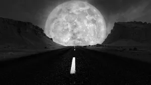 Monochrome_ Desert_ Road_ Under_ Giant_ Moon.jpg Wallpaper