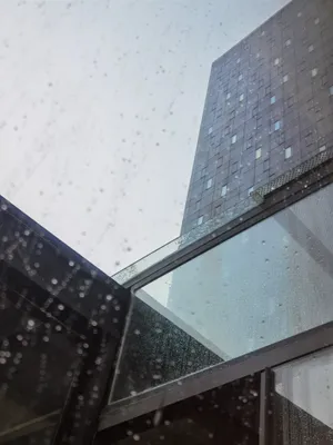 Moody Sky Over Cityscape On A Rainy Day Wallpaper