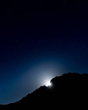Moonlight Behind Mountain Silhouette Wallpaper