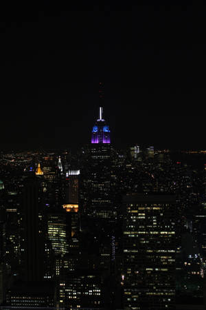 Moonlit Skyline Of The Empire State, New York At Night On Iphone Wallpaper Wallpaper