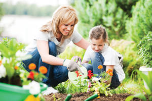 Mother And Child Gardening Wallpaper