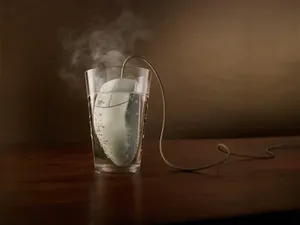 Mouse Inside Glass With Water Wallpaper