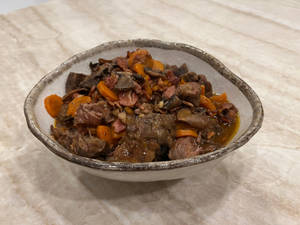 Mouthwatering Beef Bourguignon In Rustic Setting Wallpaper