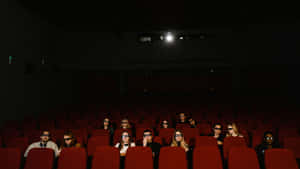 Moviegoers Wearing3 D Glasses Wallpaper