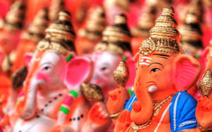 Multiple Lord Ganesha Figurines Wallpaper