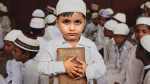 Muslim Boy Hugging Quran Wallpaper