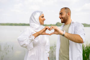 Muslim Couple Heart Symbol Pose Wallpaper