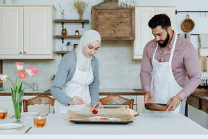 Muslim Couple In Kitchen Wallpaper