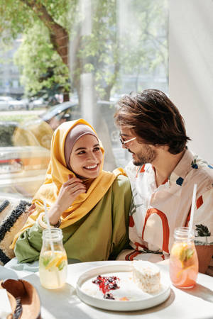 Muslim Couple On A Cafe Date Wallpaper