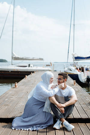 Muslim Couple On Wooden Dock Wallpaper