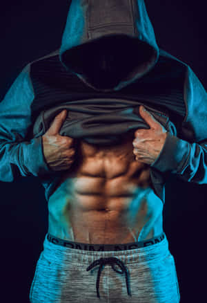 Mysterious_ Athlete_ Showing_ Abs.jpg Wallpaper