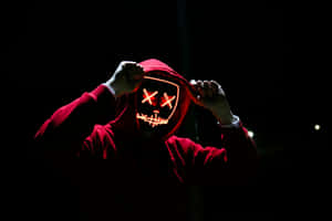 Mysterious Hooded Figurewith L E D Mask Wallpaper