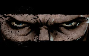 Mysterious Woman In A Hooded Cloak On A Gloomy Forest Pathway Wallpaper