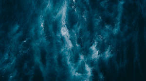Mystique Of The Navy Blue Ocean From Above Wallpaper