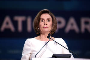 Nancy Pelosi At Event Podium Wallpaper