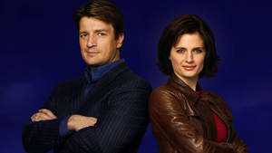 Nathan Fillion Posing On A Blue Background Wallpaper
