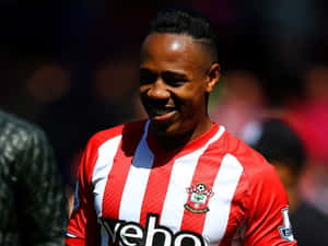 Nathaniel Clyne Smiling Brightly On The Field Wallpaper