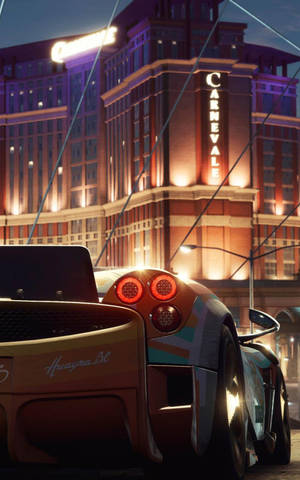 Need For Speed Car Near Tall Building Iphone Wallpaper