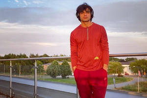Neeraj Chopra Red Tracksuit Wallpaper