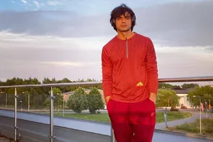 Neeraj Chopra Red Tracksuit Wallpaper