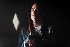 Negan In A Dimly Lit Room Wallpaper